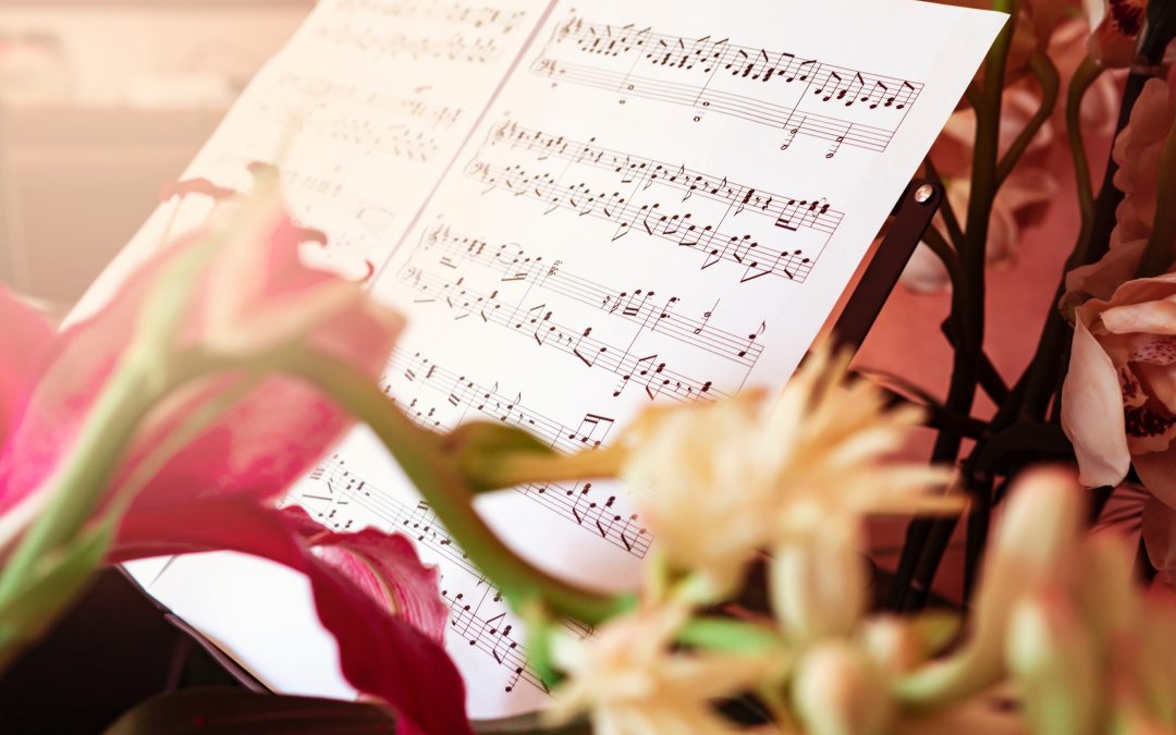 pink rose beside musical notes