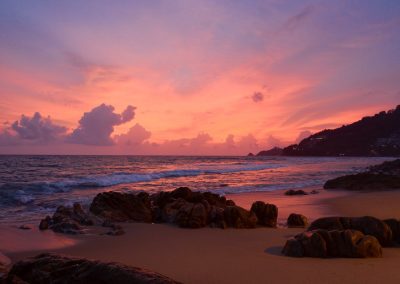 brown rocks on seashore during sunset