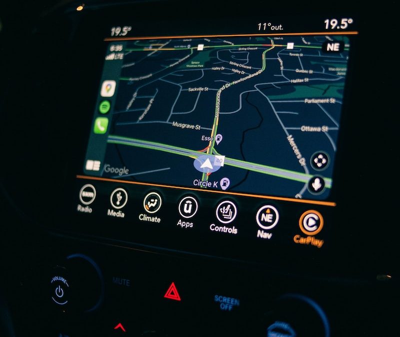 a car dashboard with a gps device in the middle of it