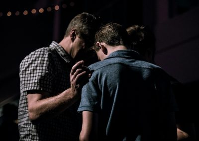 men touching each other's foreheads