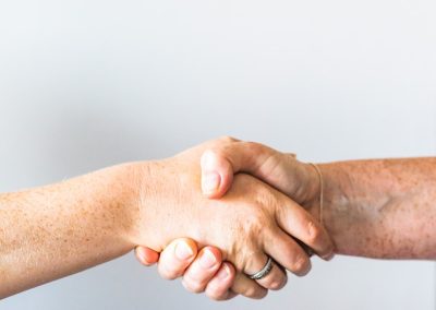 person holding hands of another person