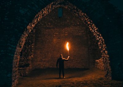 person holding torch in building interior