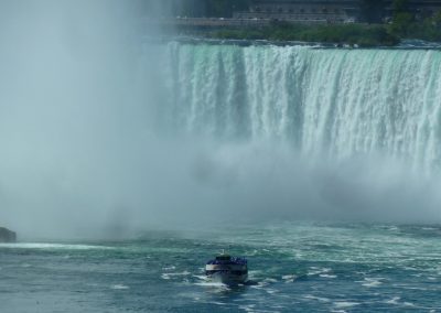 blue inflatable boat on water falls during daytime