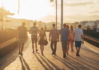 people walking on brown sand during daytime