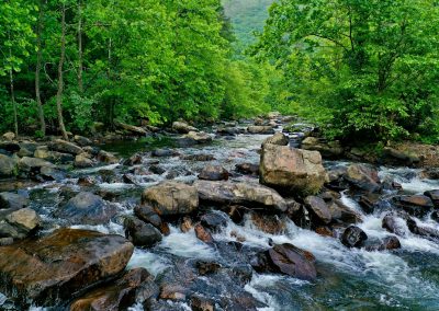 gray rocks on river during daytime
