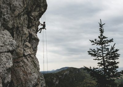 man rock climbing