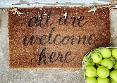 brown and black welcome rug
