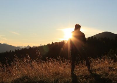 silhouette of man standing on mountain