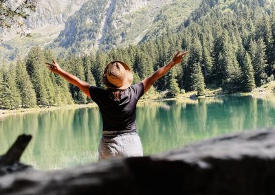 a person standing in front of a body of water